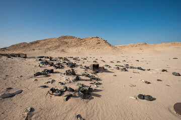 Old military army boots abandoned in remote african desert