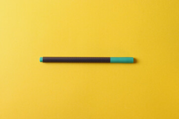 stationary pens on vivid colour yellow background. minimalism style