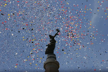statue with million of colorful balloons 