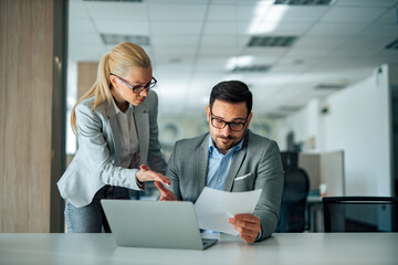 Business woman arguing with manager about work report, portrait.