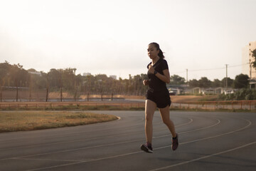 runner woman running on on the running track.