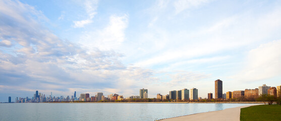 Apartment buildings in the waterfront of Montrose Harbor and downtown city skyline of Chicago at dawn, Illinois, United States.