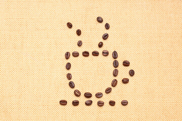 abstract cup of coffee made with coffee beans on a canvas with copy space for your text