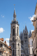 Obraz premium View of the belfry of Tournai with in the background the spires of the Tournai Cathedral