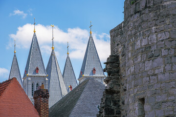 The towers of the Tournai Cathedral overlooking the houses in the city center