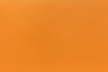 Orange uneven stucco concrete wall