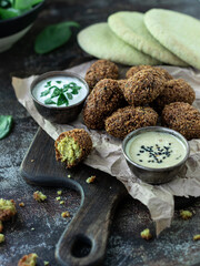 Falafel with tahini and sour cream sauce 