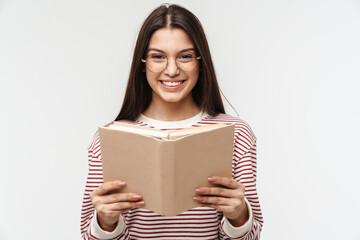 Photo of happy young woman wearing eyeglasses smiling and reading book