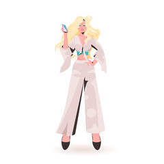 attractive woman using smartphone beautiful girl model in trendy clothes female cartoon character standing pose full length isolated vector illustration