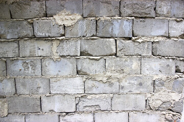 Fototapeta premium masonry old foam concrete wall with traces of masonry mortar