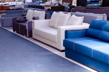 Showroom of modern furniture. Couch for sale in the store.