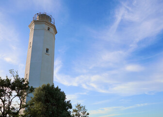 white pigeon point lighthouse with a blue sky in a sunny day