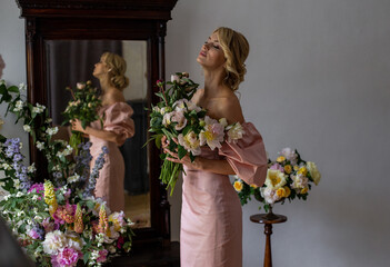 horizontal portrait of a charming blonde near the mirror