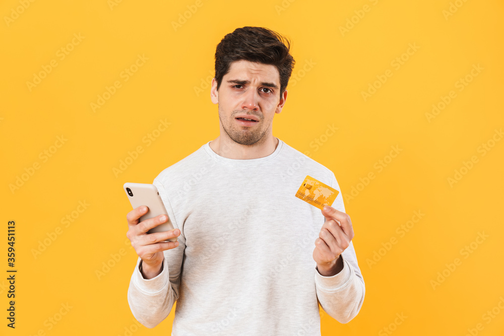 Sticker photo of handsome sick man holding credit card and smartphone