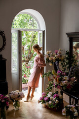 vertical portrait of a sad blonde in retro interior