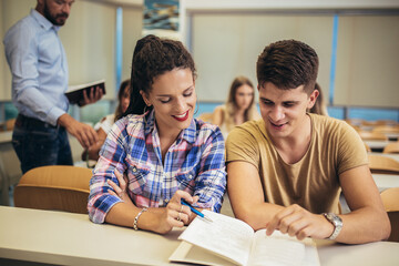 Fototapeta premium University students studying together in classroom.