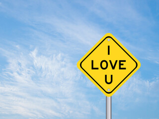 Yellow transportation sign with word I love you on blue sky background