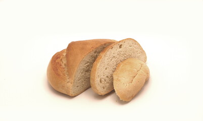 Bread with sliced pieces on a light background. Natural product. Close-up.