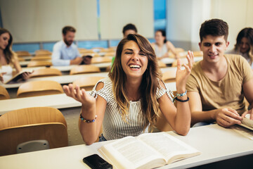 University students studying together in classroom.