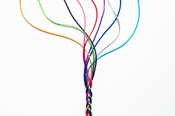 Coloured String Woven Together To Illustrate Concepts Of Unity Society Togetherness and Cooperation - obrazy, fototapety, plakaty