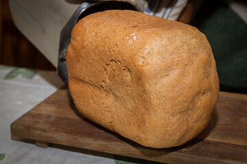 Freshly baked bread was baked at home in a bread maker