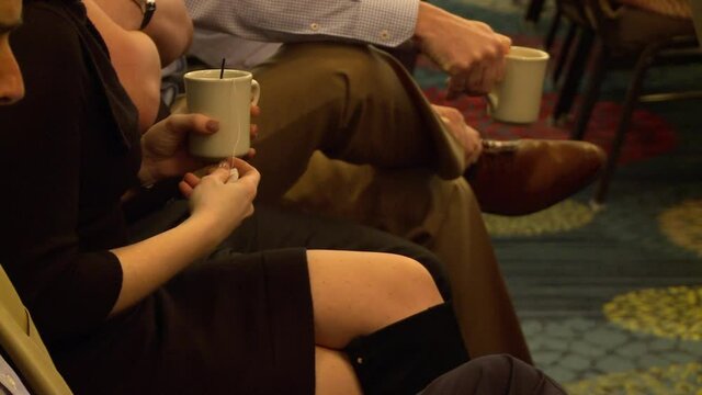 fidgety men and women with coffee and tea