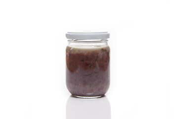Nutrition concept - Healthy food, Diet, Detox, Clean Eating or Vegetarian concept. A nutritious food on glass jars against white background. Sauce in a glass bowl.