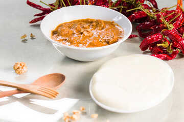 Georgian traditional food Elarji or cornflour with cheese and soup Kharcho or walnuts souse with...