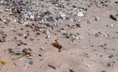 garbage on the beach, dirty sea
