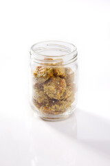 Nutrition concept - Healthy food, Diet, Detox, Clean Eating or Vegetarian concept. A nutritious food on glass jars against white background.