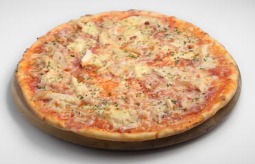 tagliata pizza on a wooden board on a white plate with veal and cheese