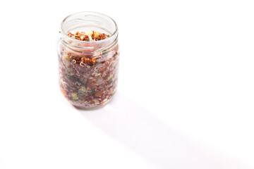 Nutrition concept - Healthy food, Diet, Detox, Clean Eating or Vegetarian concept. A nutritious food on glass jars against white background. Delicious salad in a glass jar. 