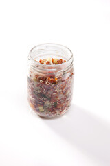 Nutrition concept - Healthy food, Diet, Detox, Clean Eating or Vegetarian concept. A nutritious food on glass jars against white background. Delicious salad in a glass jar. 