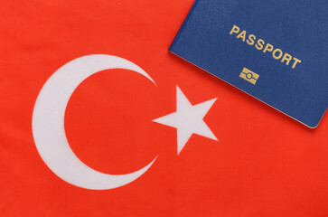 Travel concept. Passport against the background of Turkish flag