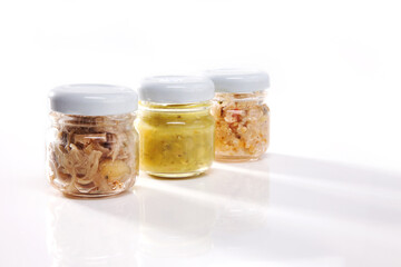 Nutrition concept - Healthy food, Diet, Detox, Clean Eating or Vegetarian concept. A glass jar of nutritious food against white background. Delicious take away food in glass jars.
