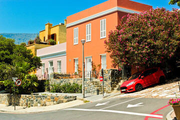 Red slanted sports car, Bo-Kaap district, Cape Town.