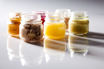 Nutrition concept - Healthy food, Diet, Detox, Clean Eating or Vegetarian concept. A glass jar of nutritious food against white background. Delicious take away food in glass jars.