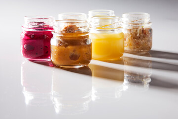 Nutrition concept - Healthy food, Diet, Detox, Clean Eating or Vegetarian concept. A glass jar of nutritious food against white background. Delicious take away food in glass jars.