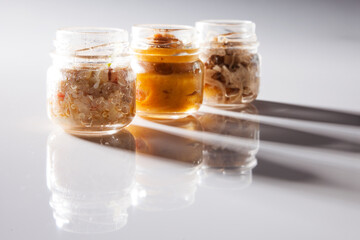 Nutrition concept - Healthy food, Diet, Detox, Clean Eating or Vegetarian concept. A glass jar of nutritious food against white background. Delicious take away food in glass jars.