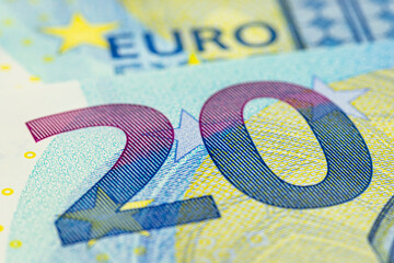 Macro shot of a European Union banknote of 20 EUR, close-up of the number twenty.
