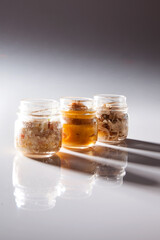 Nutrition concept - Healthy food, Diet, Detox, Clean Eating or Vegetarian concept. A glass jar of nutritious food against white background. Delicious take away food in glass jars.