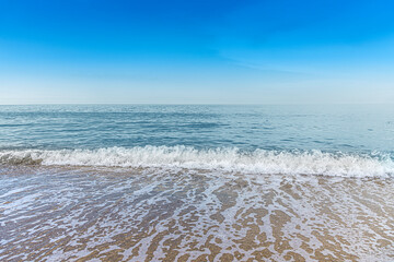 Seascape at sunset. Beautiful evening sky at sunset and sea surf.
