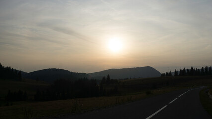 Fototapeta na wymiar mountain road sunset