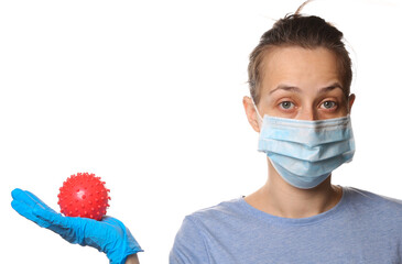 Pandemic covid-19 theme. Woman in protective gloves, medical face mask holds a virus strain model...
