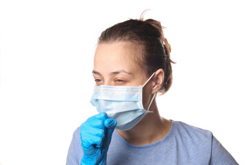 Symptoms of the flu. Woman in medical mask coughs isolated on a white background. Covid-19.