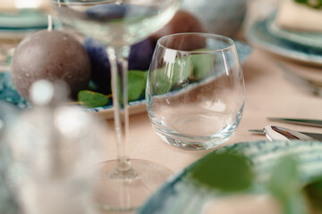 Luxury green table setting decorated with candles