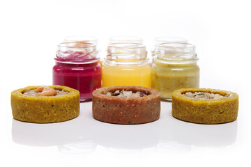 Nutrition concept - Healthy food, Diet, Detox, Clean Eating or Vegetarian concept. Glasses of food and small quiches. Nutritious food against white background. 