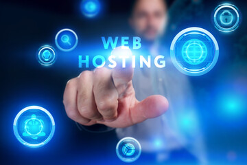 Business, Technology, Internet and network concept. Young businessman working on a virtual screen of the future and sees the inscription: Web hosting