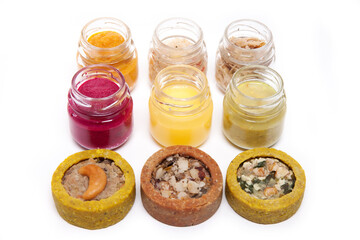 Nutrition concept - Healthy food, Diet, Detox, Clean Eating or Vegetarian concept. Glasses of food and small quiches. Nutritious food against white background. 