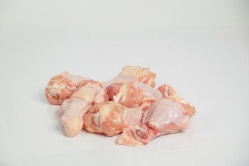 raw chicken leg on a white background